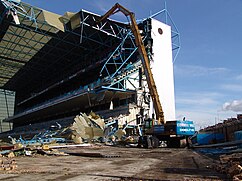 Demolition of stand with Specialist high reach excavator.jpg