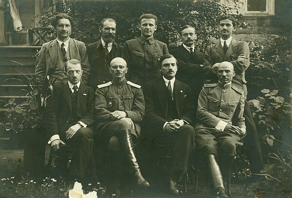 The first government of the People's Republic. Sitting, left to right: Aliaksandar Burbis, Jan Sierada, Jazep Varonka, Vasil Zacharka. Standing, left 