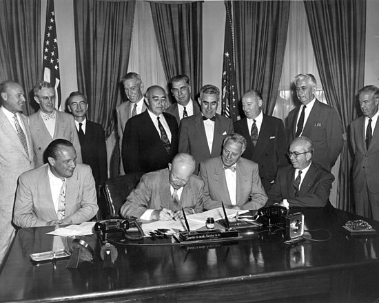 President Eisenhower signs the Atomic Energy Act of 1954.