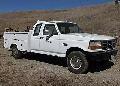 Ford F-250, which was originally sold as a chassis cab, fitted with an aftermarket utility bed.