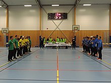 Brazil and Greece women's goalball teams line-up at the start of the first half. Goalball World Championships, Malmo, Sweden (June 2018). Goalball-2018 World BRA-GRE F line-up.jpg