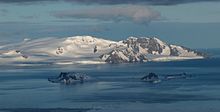 Ephraim Bluff (in the centre) from near Camp Academia, with Half Moon Island and McFarlane Strait in the foreground. Greenwich.jpg