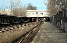 2006 photograph from the Dyre Avenue platform with a train beneath the station approaching the East 180th Street-bound platform. Gun Hill Road.jpg