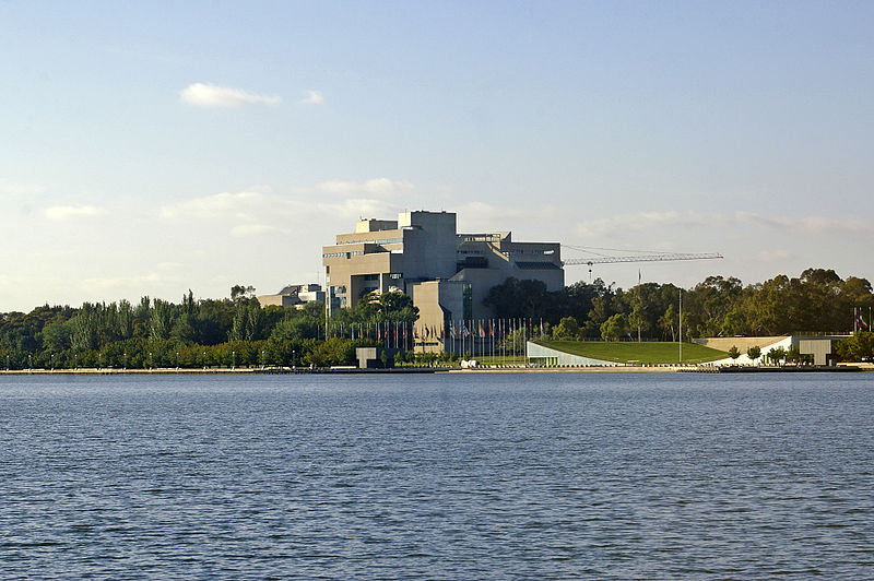 File:High Court of Australia building and International Flag Display viewed across Lake Burley Griffin from Commonwealth Park.jpg