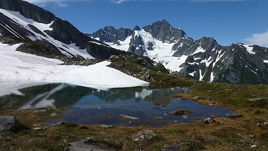 Kool-Aid Lake. Mount Formidable is in the background. The lake is on the route of the Ptarmigan Traverse.