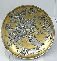 Silver partly gilded dish with the favourite subject of the king hunting, 7th century