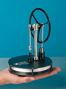 A low-temperature-difference Stirling engine, shown here running on the heat from a warm hand MM-7 Stirling Engine.jpg