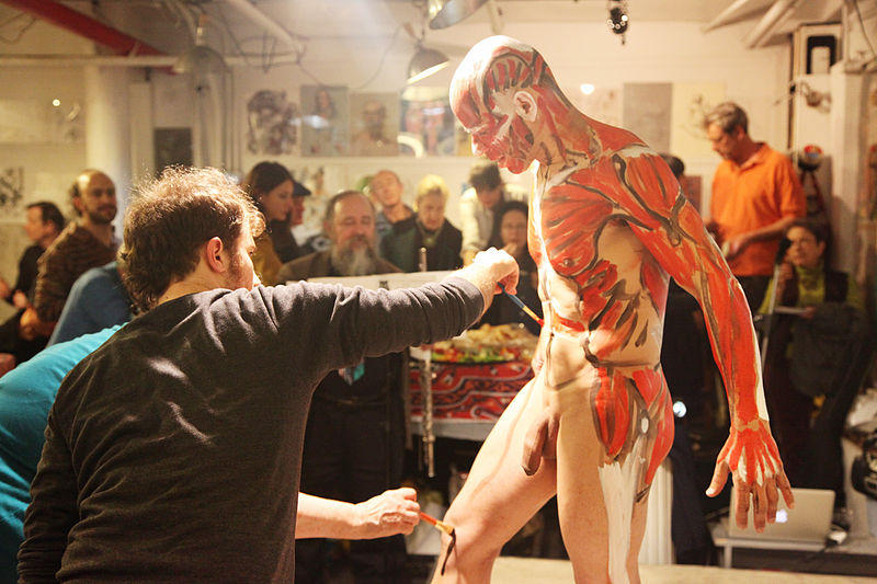 File:Man receiving body paint.jpg