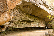 Mary Campbell Cave. Note the woman at the far end of the cave, for scale. Mary Campbell Cave 1.jpg