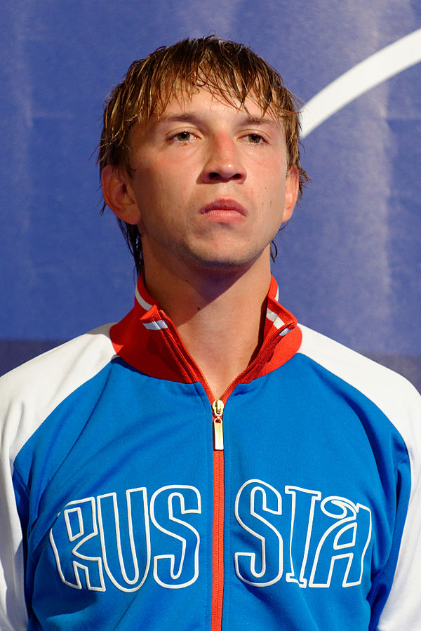 Nikolay Kovalev stands on podium after winning gold at 2014 Kazan World Championships.