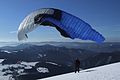 * Nomination: Paraglider in Veľká Fatra, Slovakia --Pudelek 10:43, 16 February 2009 (UTC) * Review  Comment A bit noisy sky and slight vignetting in upper right corner. Also, the shadow in lower right corner could be edited away (but not cropped, you'll lose the composition). Excellent composition. --Siipikarja 15:03, 16 February 2009 (UTC)  Info new version - only small crop --Pudelek 10:51, 19 February 2009 (UTC)