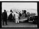 People disembarking from Guinea Airways Ltd plane(GN14413).jpg