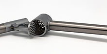 Many garlic presses also have a device with a matching grid of blunt pins to clean out the holes. Presse-ail ikea koncis 09.jpg