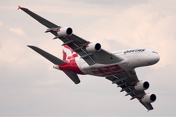 A Qantas Airbus A380 flies over the MCG on grand final day.