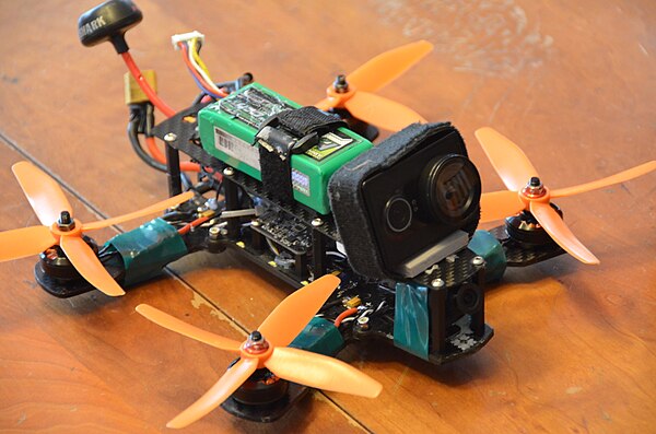 Typical racing quadcopter with carbon fiber frame and FPV camera