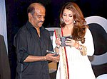 Rajinikanth (kiri) dengan Aishwarya Rai (kanan) pada peuncuran rekaman versi Hindi dari Enthiran, Robot. Penampilan Rajinikanth dalam film tersebut membuatnya meraih beberapa penghargaan dan nominasi