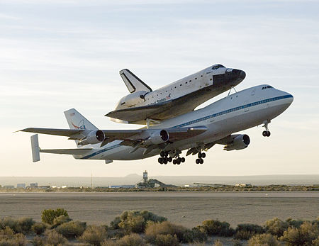 A 747 Shuttle Carrier Aircraft carrying the space shuttle Atlantis taking off from Edwards Air Force Base in California on 1 July 2007 STS117TakeoffEdwardsSCA.jpg