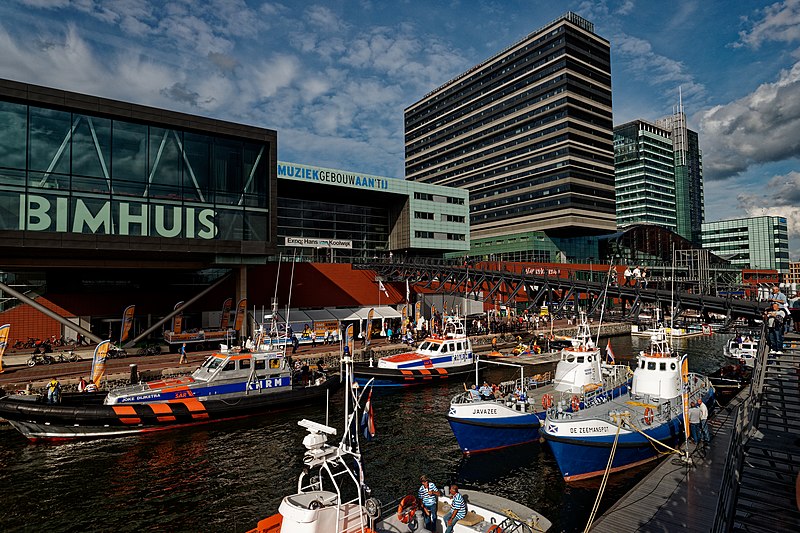 File:Sail Amsterdam - Piet Heinkade - View NW on KNRM Lifeboats, Bimhuis & Mövenpick Hotel.jpg