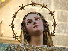 A statue of Mary crowned with 12 stars, a reference to Revelation 12. Statue by Attard, Malta. Santa Marija Assunta.jpg