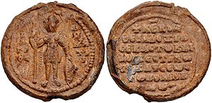 Obverse and reverse of seal, with a standing military saint and a legend in Greek