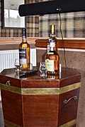 Single malt Scotch whisky bottles & glasses in hotel bar - Laggan Hotel, Newtonmore (2017-06-22 16.08.13 by Nick Amoscato).jpg