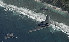 A B-2A Spirit stealth bomber from the 509th Bomb Wing escorted by two F-22A Raptor stealth fighters from the 3rd Wing Stealth-y patrol - 090421-F-0000B-301.jpg