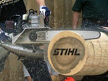 "Stihl" is burnt into or marked on the log and brands the resulting cookies Timbersports hotsaw 200404a Waiblingen.jpg