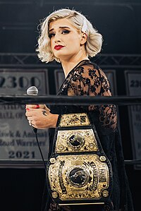 "Timeless" Toni Storm as with the AEW Women's World Championship in April 2024 during her third reign as champion. Toni Storm in April 2024 (cropped).jpg