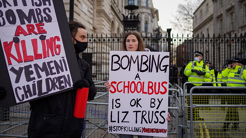 File:Two protesters outside Downing Street highlighting the UK's complicity in Saudi Arabia's bombing campaign against Yemen.jpg