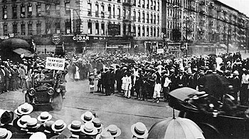 A Universal Negro Improvement Association parade in Harlem, 1920. A sign on a car says "The New Negro Has No Fear". UNIA parade in Harlem, 1920.jpg