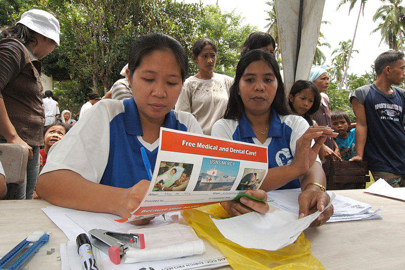 File:US Navy 060529-N-6501M-012 Local Filipino volunteers prepare the necessary paperwork needed to participate in a Medical Civil Action Program (MEDCAP) located on Basilan Island.jpg