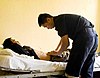 US Navy 090715-N-9689V-008 Republic of Singapore Navy Maj. Boon Hor Ho examines a local man suffering from abdominal pain during a Pacific Partnership 2009 medical civic action project at Niu'ui Hospital.jpg