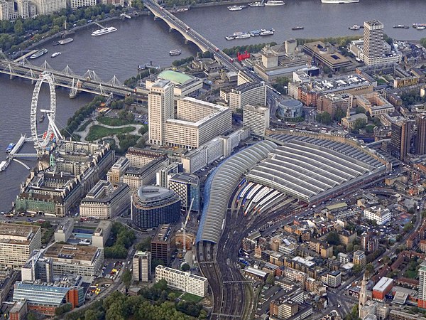 Aerial view from the south, showing Waterloo station, Waterloo and Hungerford Bridges and the London Eye