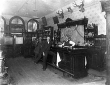 Bartender and two patrons at the Toll Gate Saloon, Black Hawk, Colorado, c. 1897 1897 Saloon Blackhawk.jpg