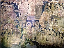 Cave 17: many foreigners are included as devotees attending the Buddha's descent from Trayastrimsa Heaven Ajanta Cave 17 frescoe.jpg