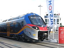 Davanti a un ETR 103 in mostra a InnoTrans.