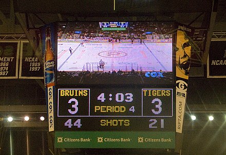 A scoreboard showing an overtime period. Since there are typically three periods in hockey, the fourth period is the overtime period.