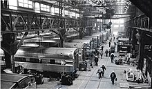 Amtrak trains are serviced at the Beech Grove Shops in 1980. Amtrak cars undergoing HEP conversion at Beech Grove, 1980.jpg