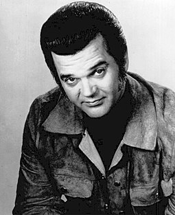 Conway Twitty topped the chart with "Hello Darlin'", which came to be regarded as his signature song. Conway Twitty 1974.JPG