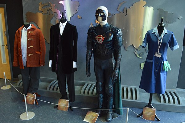 The costumes of Nardole, The Doctor, The Ghost and Lucy in this episode, on display at the Doctor Who Experience.