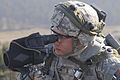 Defense.gov News Photo 120321-A-ML570-006 - U.S. Army Spc. Zachary Dixson with the 173rd Airborne Brigade Combat Team uses a spotting scope to watch for simulated enemy combatants during an.jpg