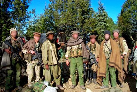 Delta Force GIs disguised as Afghan civilians, while they searched for bin Laden in November 2001