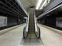 An escalator at Macquarie University railway station