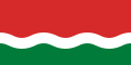 La flago de la Sejŝeloj ekde 1977 ĝis 1996. Horizontalaj strioj ruĝa kaj verda dividitaj per blanka ondo.