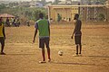 Football Players on Soil Field