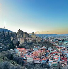 Tbilisi, especially Old Town, has a complex terrain, with hills and cliffs Fortress and Old Town of Tbilisi at dusk, Tbilisi, Georgia.jpg