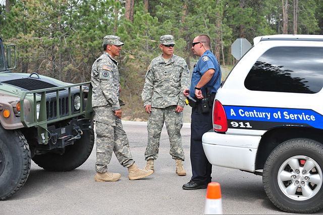 Colorado Army National Guardsmen assisting law enforcement in providing security for evacuated homes during a forest fire