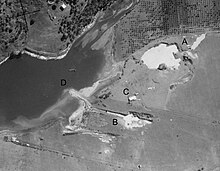 Geilston Bay, Tasmania, aerial photograph 26 Mar 1946 (detail). Annotations (A-D) added by Tony Rees in January 2023: A & B: sites of former quarrying activities still visible in 1946; C: building, no longer extant; D: jetty from where lime and later, limestone was dispatched by boat Geilston Bay 1946 0015 949 detail.jpg