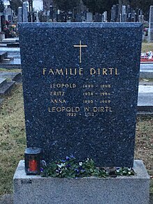 alt=A tombstone with a gold cross. The inscription reads: Dirtl Family Leopold 1890-1948 Fritz 1928-1956 Anna 1895-1969 Leopold W Dirtl 1922-2012