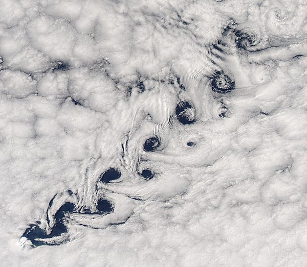 Vortex shedding as winds pass Heard Island resulted in this Kármán vortex street in the clouds.